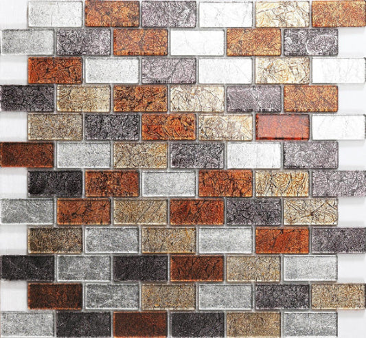 A mosaic tile wall featuring an array of autumn-colored tiles including gold, red, grey, and silver shades, arranged in a brick pattern.